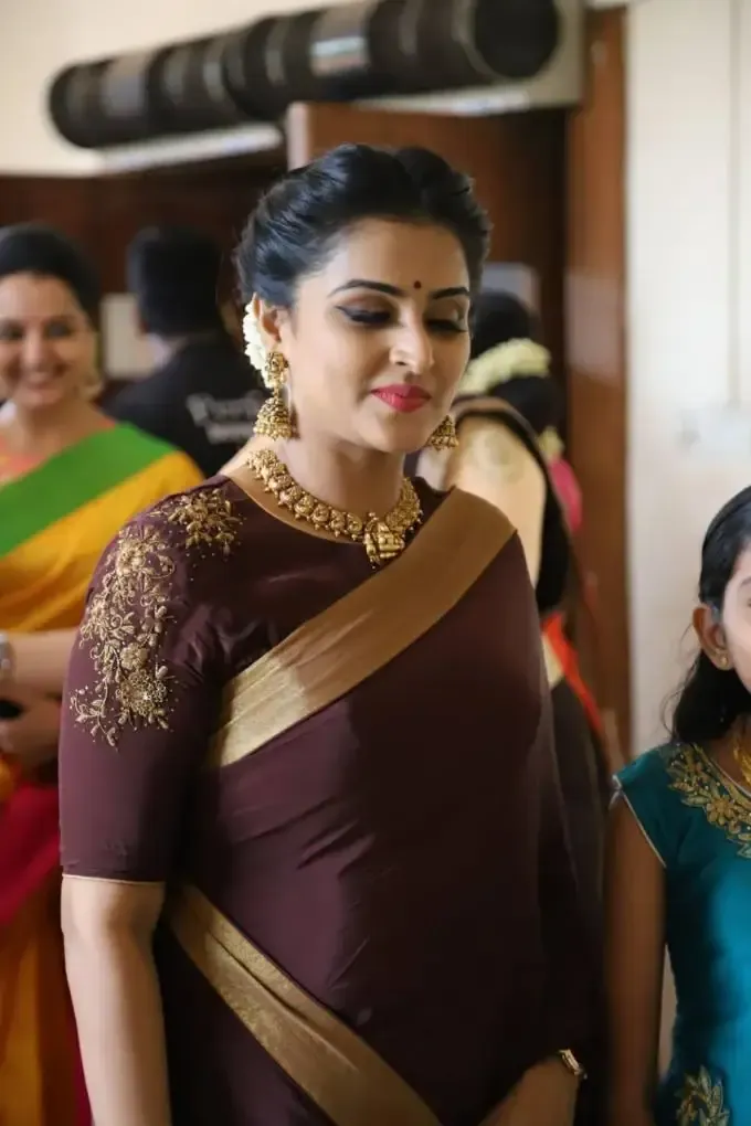 Actress Remya Nambeeshan In Traditional Maroon Saree